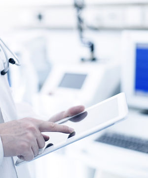 Doctor Using Digital Tablet