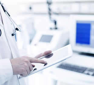 Doctor Using Digital Tablet