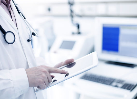 Doctor Using Digital Tablet