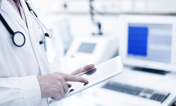 Doctor Using Digital Tablet