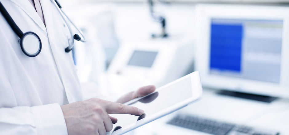 Doctor Using Digital Tablet