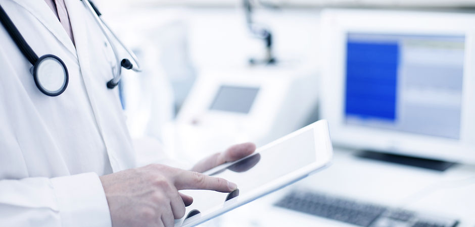 Doctor Using Digital Tablet