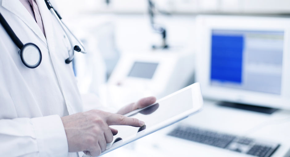 Doctor Using Digital Tablet