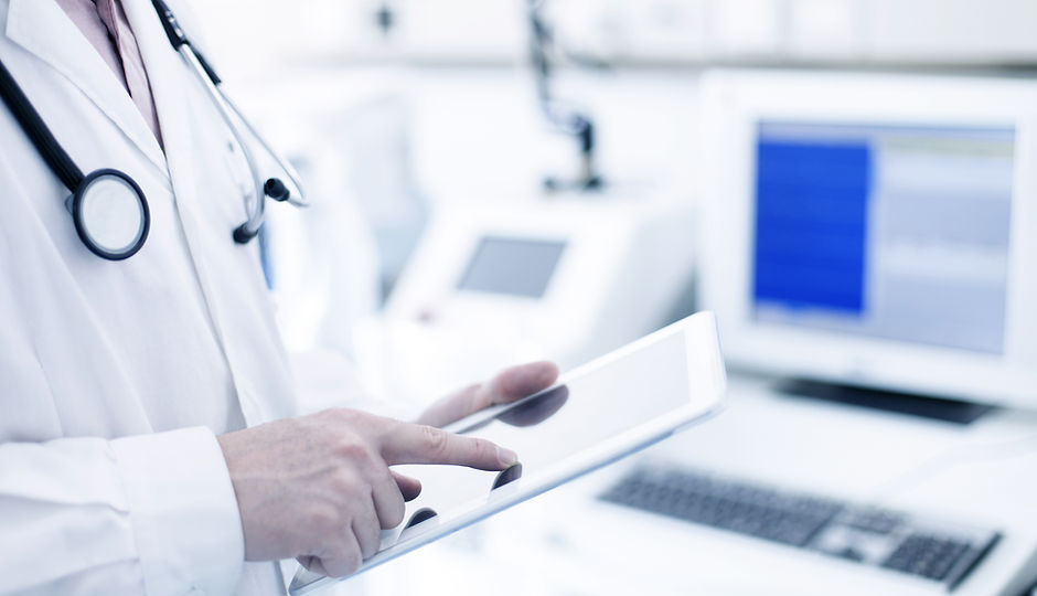 Doctor Using Digital Tablet