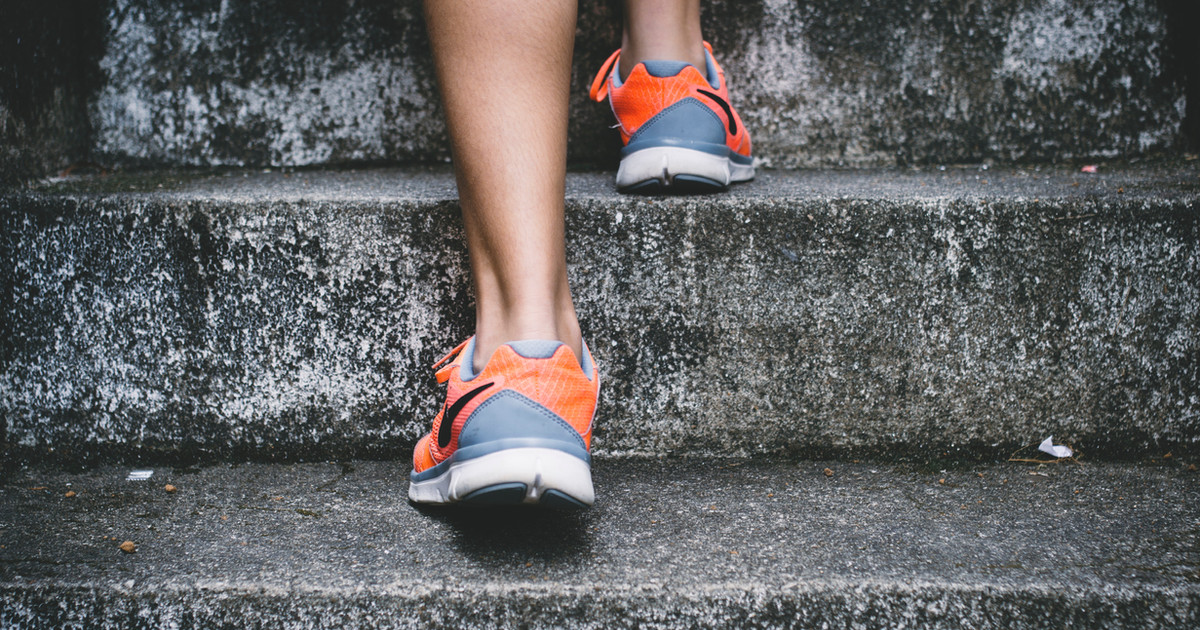 A person confidently completing everyday activities such as standing from a chair, climbing stairs and carrying groceries after rebuilding movement and strength.