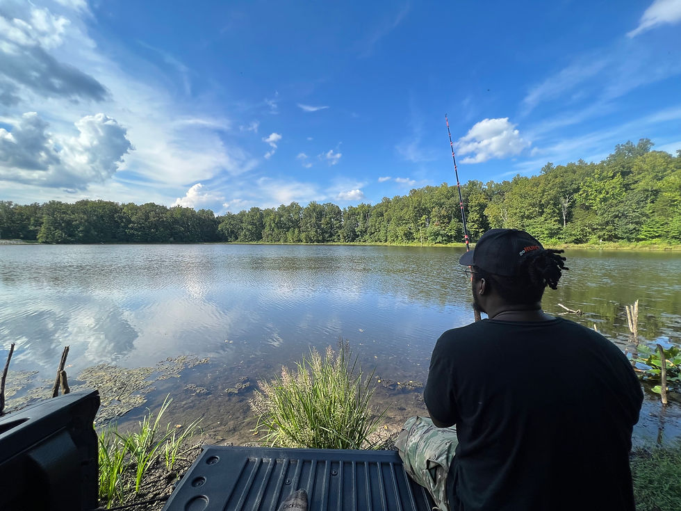 Author fishing from the bed of his truck