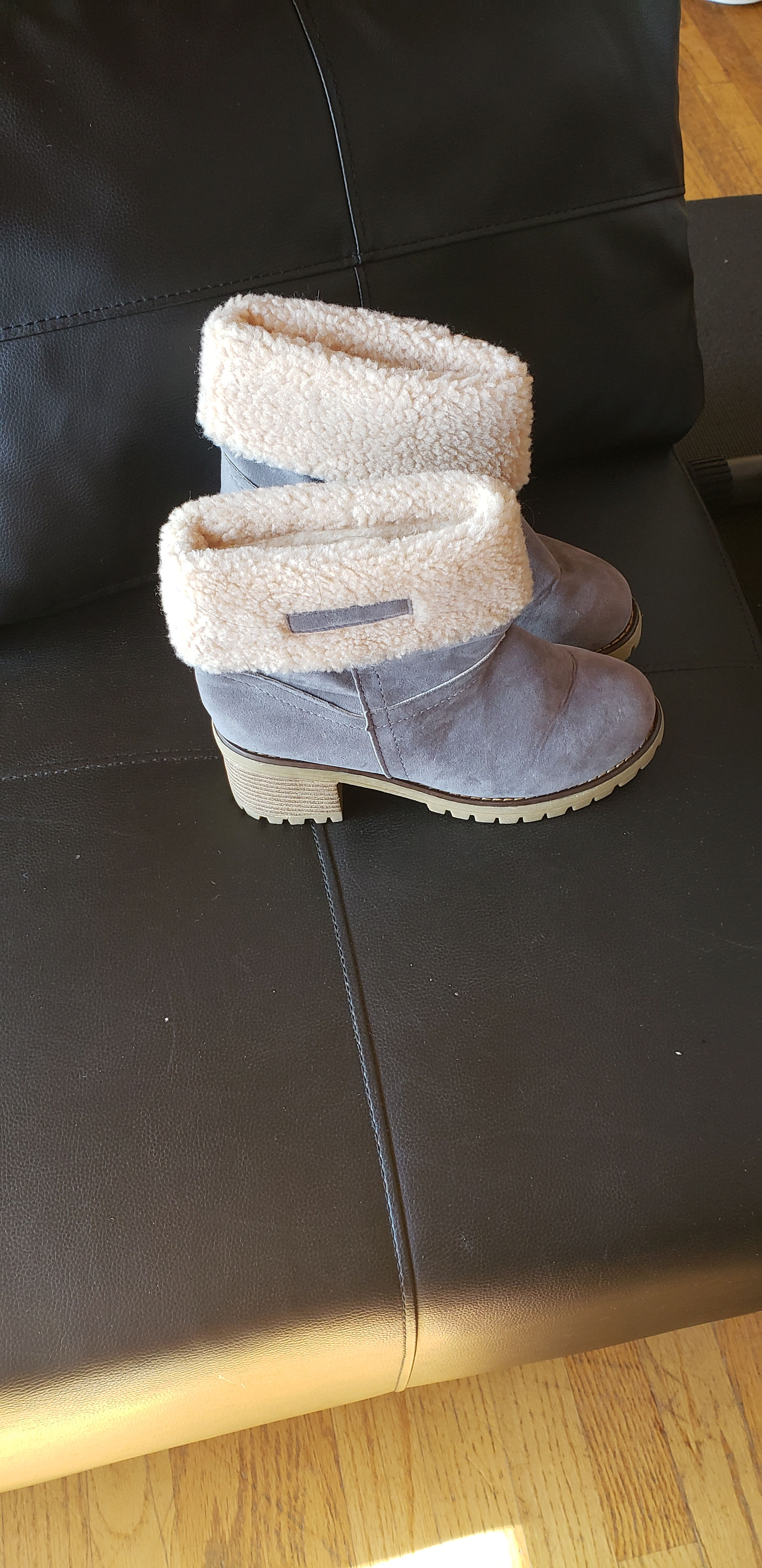 Pair of grey suede ankle boots with cream sherpa cuff