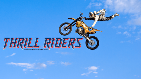 Freestyle motocross rider performing a daring midair motorcycle stunt against a bright blue sky, alongside the Thrill Riders series title.