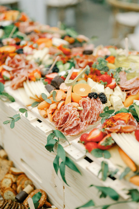 Gourmet charcuterie board display for a custom menu at greenhouse wedding