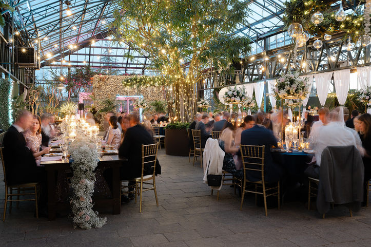 Luxury greenhouse reception during dinner service