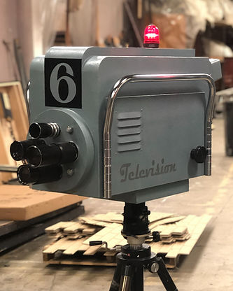 Blue 60's style faux TV camera, facing left