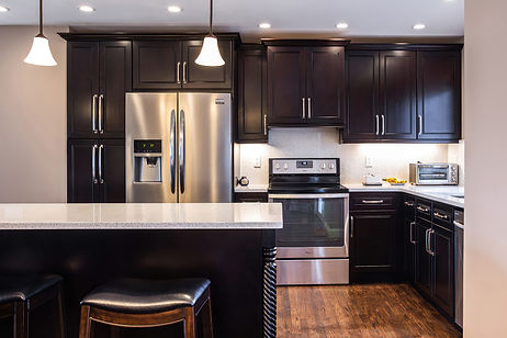 Perfect for Transitional or Contemporary Interior Designs, This Quality All Wood Cabinets Features a Modern Raised Panel Door Style with Decorative Bead Detail and a Dark Espresso Brown Stained Wood Finish. These Premium Cabinets are In-Stock and Ready to Ship to Your Home or Jobsite - Request a Free Kitchen Design or Quote to Start Your Cabinet Project.