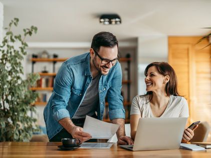 Couple Comparing Kitchen Cabinet Quotes