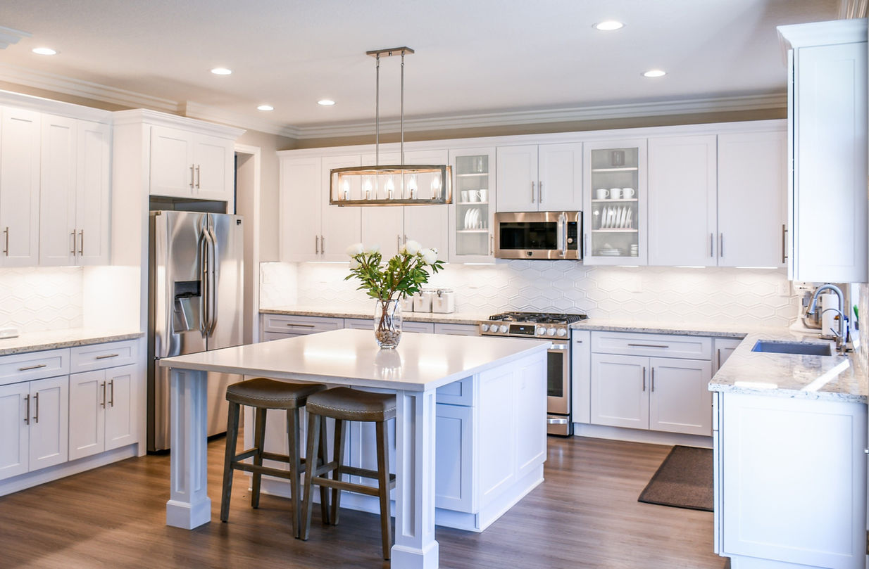 The Sonoma White Shakers can ship flat-packed or fully assembled. These bright white cabinets brighten this kitchen with tall 40" wall cabinets and crown molding.