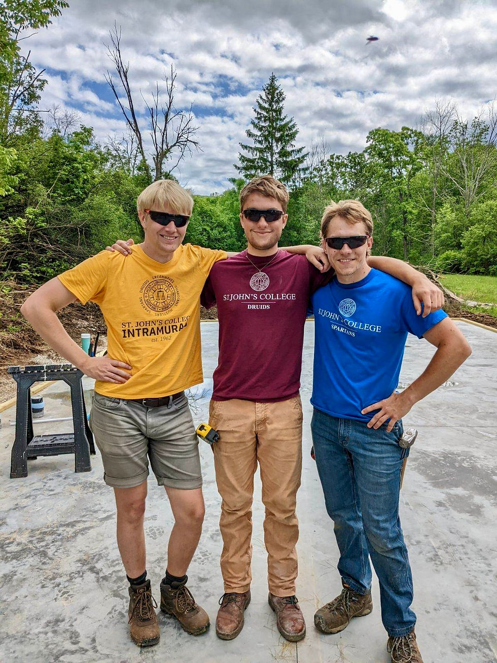 Tait, Dolan, and Isaac just 10 weeks ago - standing on the empty slab, ready for their housebuilding challenge