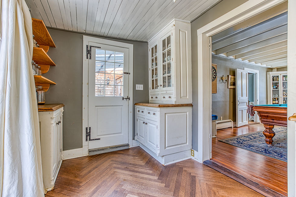 We also created openings in the pantry to the new kitchen and the greenhouse. We turned the old dining room into a billiard room. Credit: Tricia McCormack Photography.