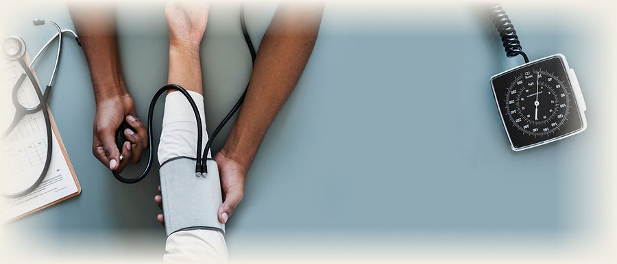 A physician taking a patient's blood pressure
