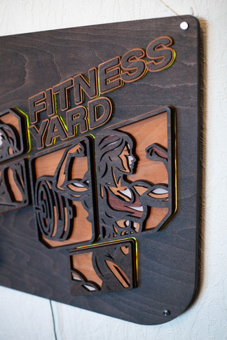 Layered FITNESS YARD sign with strong woman