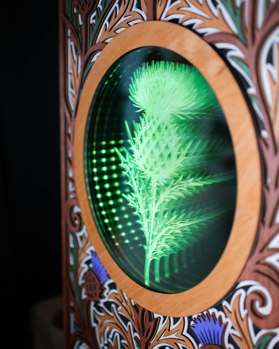 Thumbnail: Decorative wooden frame with glowing green thistle