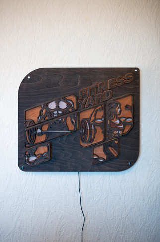 FITNESS YARD wooden sign with gym equipment cutouts