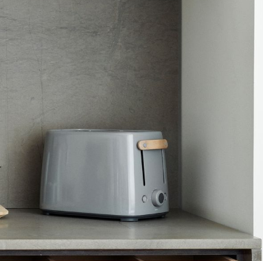 Emma Toaster in Grey with Beech Handle by Stelton, Denmark.   A design classic by Holmbäck Nordenoft, known for its clean lines and innovative material combinations with steel and moulded beech wood, that lends to the Danish design tradition from the 1950s.