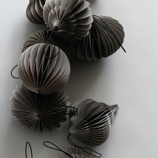 Sustain Holiday Christmas ornaments, folding, reclaimed material by Nordstjerne, Denmark. Scandinavian and Nordic design online for wholesale to retailers. Top Danish design products for the home, that are modern, sustainable, ethical and eco-made products for the home..