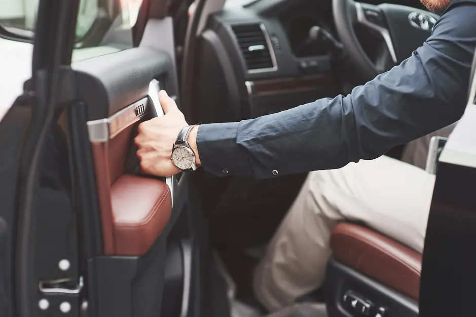beautiful-young-man-full-suit-while-driving-car (1).webp