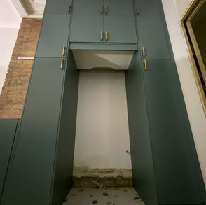 IKEA kitchen with green doors.