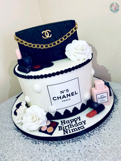 Chanel bag cake with matching perfume and makeup.