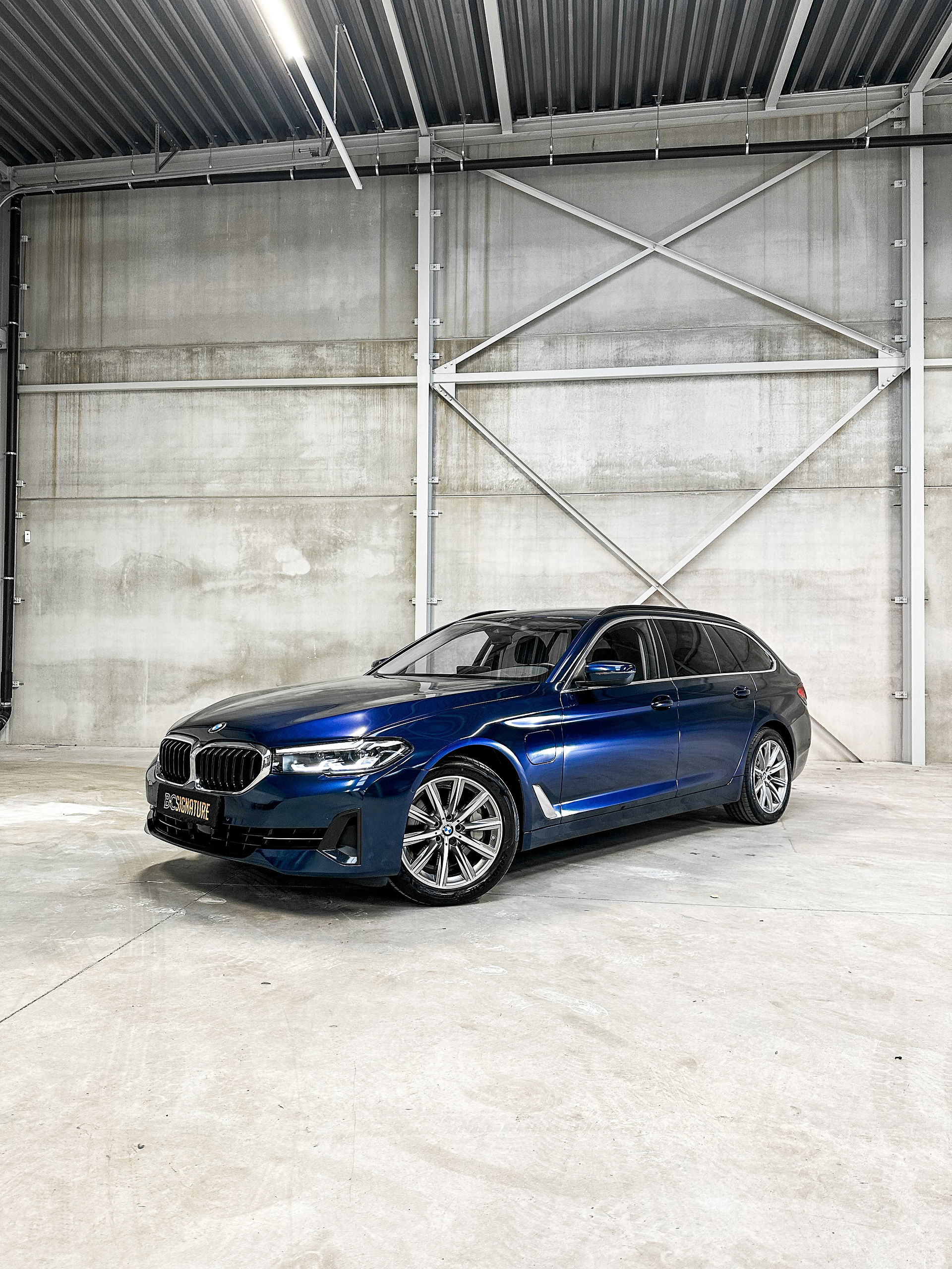 BMW 530e wrapped in KPMF Black Blue Iridescent