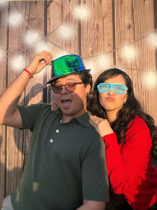 Couple in party hats and sunglasses