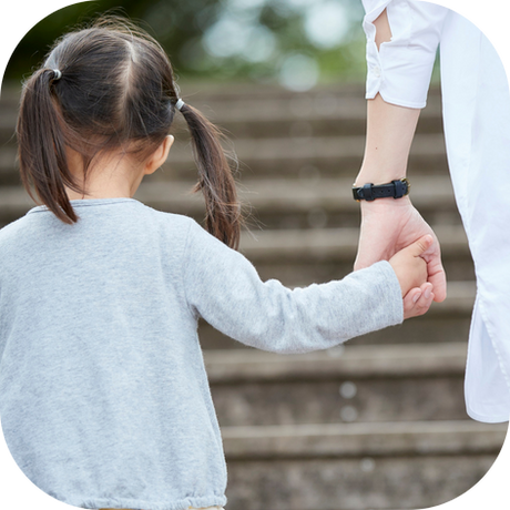 The parent smiles gently, leaning in to listen closely, radiating patience and genuine interest. The parent is able to get tp the root of why the child was lying.