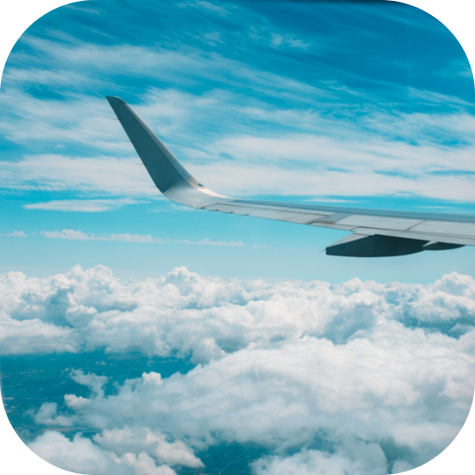 A child is sitting on an airplane looking anxious as they prepare for an upcoming trip. Their nervousness may stem from travel-related fears, and they are surrounded by new environments, which can trigger feelings of anxiety and stress.