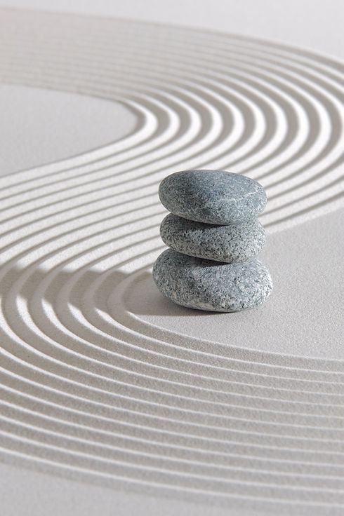 Lines in sand and stone symbolizing neural pathway rewiring, nervous system regulation, and grounding in neurobiology-based anxiety therapy.