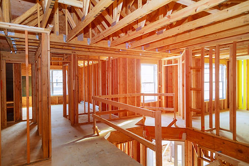 new-home-construction-with-wooden-house-frame-buil-2021-09-04-10-21-46-utc-min.jpg