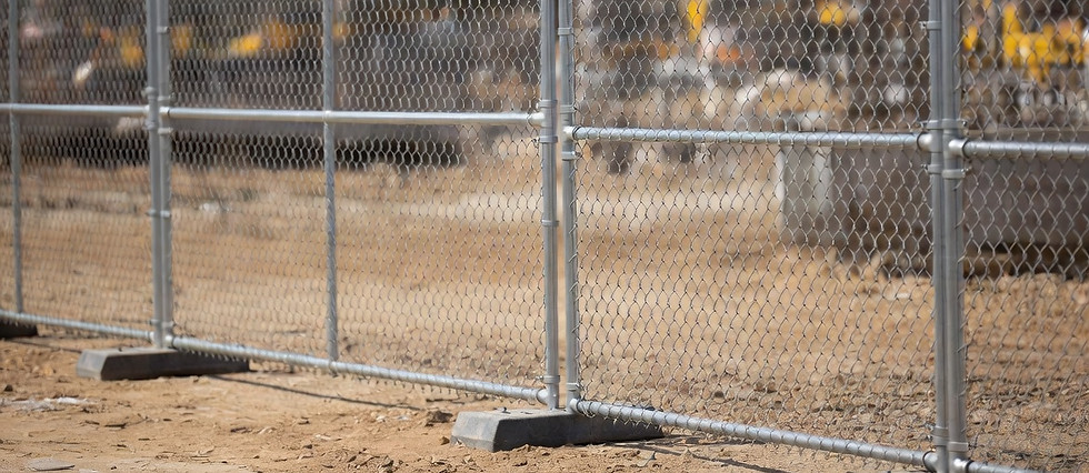 Chainlink fence with block