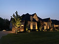 Elegant house with exterior lighting at night