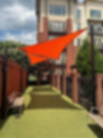 Orange triangular shade sails