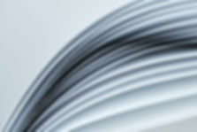 several-curved-sheets-of-paper-on-a-white-backgrou-2023-11-27-05-19-18-utc-min.jpg