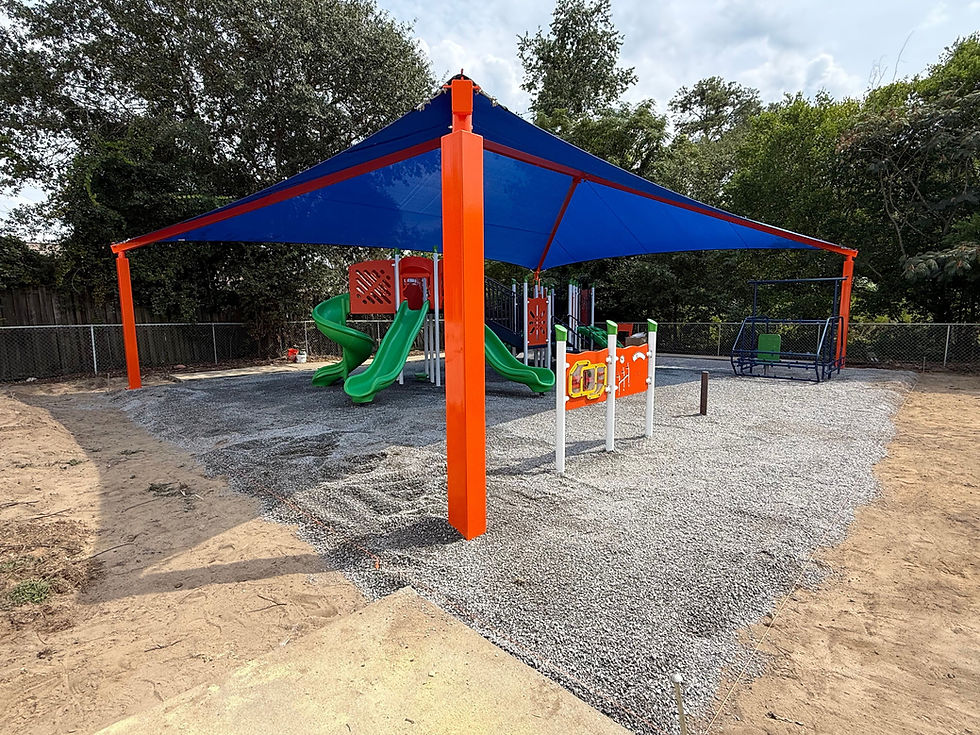 Playground with blue and orange shade structure