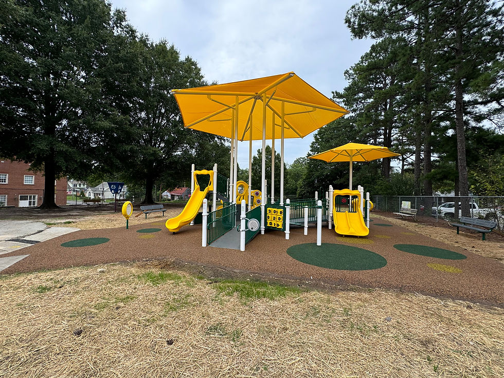 Yellow playground with slides and shade canopies