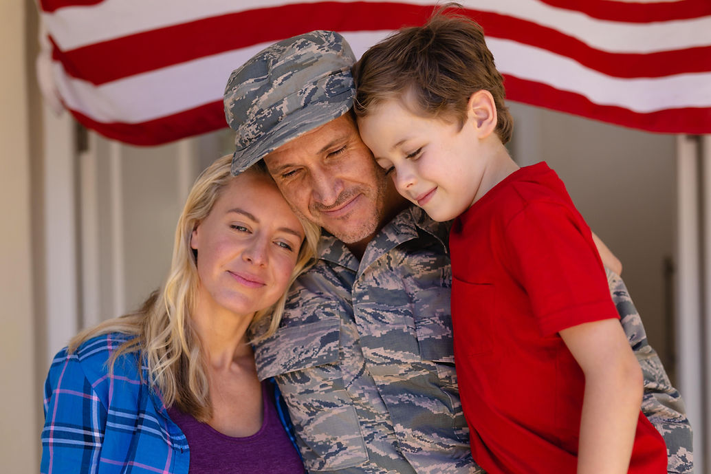 caucasian-family-with-military-man-standing-entran-2022-01-31-18-35-34-utc-min.jpg