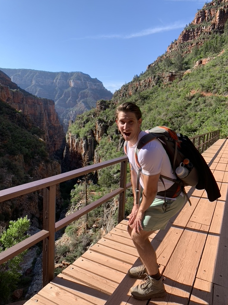 The author in a sorority squat on a bridge in the Grand Canyon