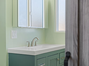 Remodeled bathroom highlighting modern lighting and luxury finishes