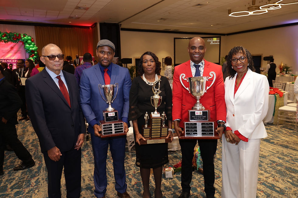 Executive Chairman of LASCO Affiliated Companies James E. D. Rawle, CD, (left) and CEO of the LASCO Chin Foundation Professor Rosalea Hamilton (far right) stand with the 2023-2024 awardees, Principal of the Year Rayon Simpson, TVET Teacher of the Year Ilene Cohall-Bailey, and Teacher of the Year Franklin Burrell, whose smiles were glowing following the honour received.