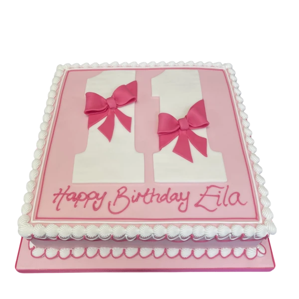 Bespoke 12" square celebration cake with large number topper and decorative bows in Solihull, West Midlands.