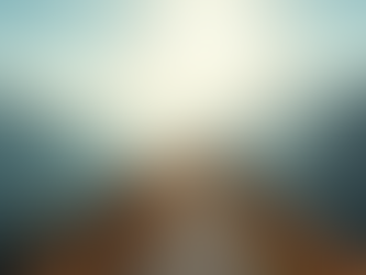 Eye-level view of a winding mountain path under a bright sky symbolizing a journey toward success