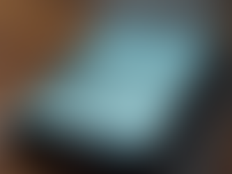 Eye-level view of a smartphone screen showing a social media feed filled with sensational headlines