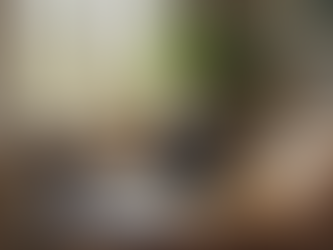 Eye-level view of a cozy home study corner with a laptop and books for online tutoring