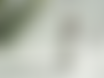 Close-up view of a serum bottle with a dropper on a marble surface